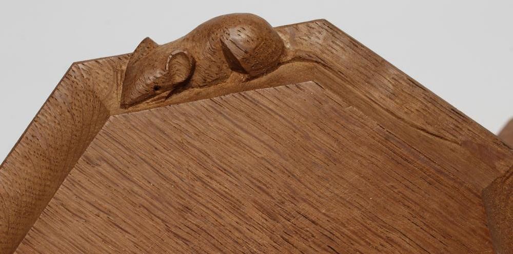 A ROBERT THOMPSON ADZED OAK SMALL CHOPPING BOARD/STAND of octagonal form Image