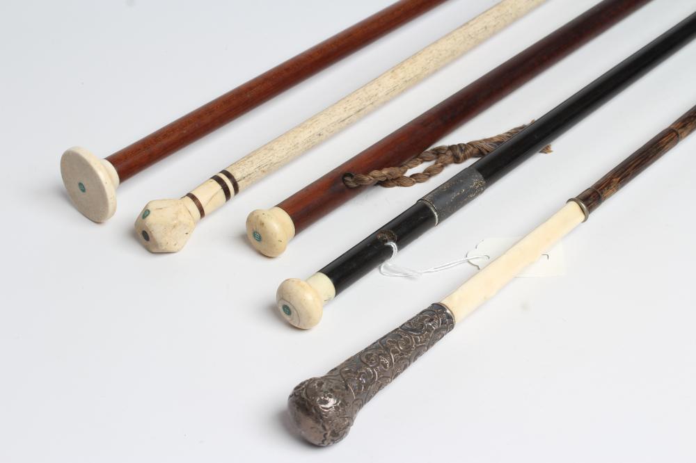 A COLLECTION OF FIVE REGENCY AND LATER WALKING CANES comprising rosewood (?) with eyelets and plain Image