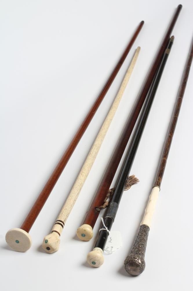A COLLECTION OF FIVE REGENCY AND LATER WALKING CANES comprising rosewood (?) with eyelets and plain Image