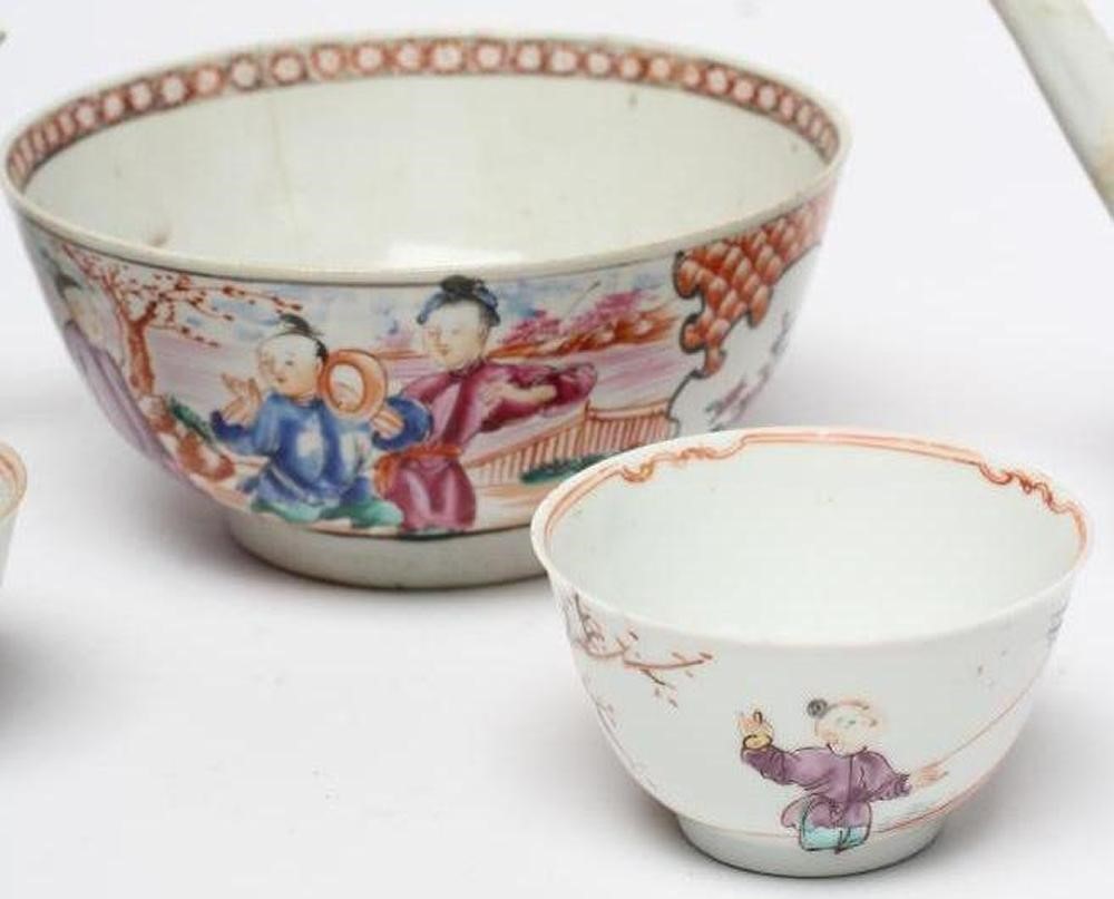 A COLLECTION OF CHINESE POLYCHROME PORCELAIN comprising a teapot and cover painted with figures on a Image