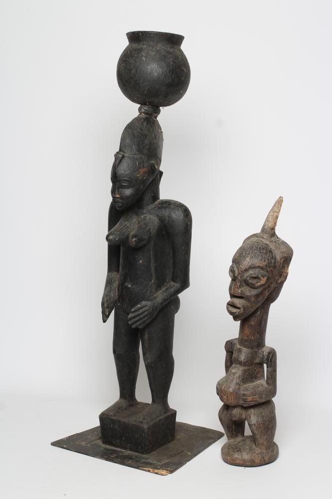 AN AFRICAN TRIBAL MATERNITY FIGURE carved in hard wood with head spike Image