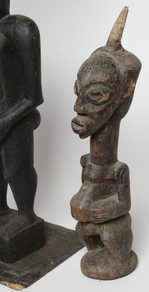 AN AFRICAN TRIBAL MATERNITY FIGURE carved in hard wood with head spike Image