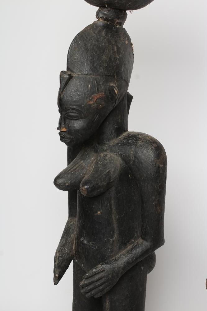 AN AFRICAN TRIBAL MATERNITY FIGURE carved in hard wood with head spike Image