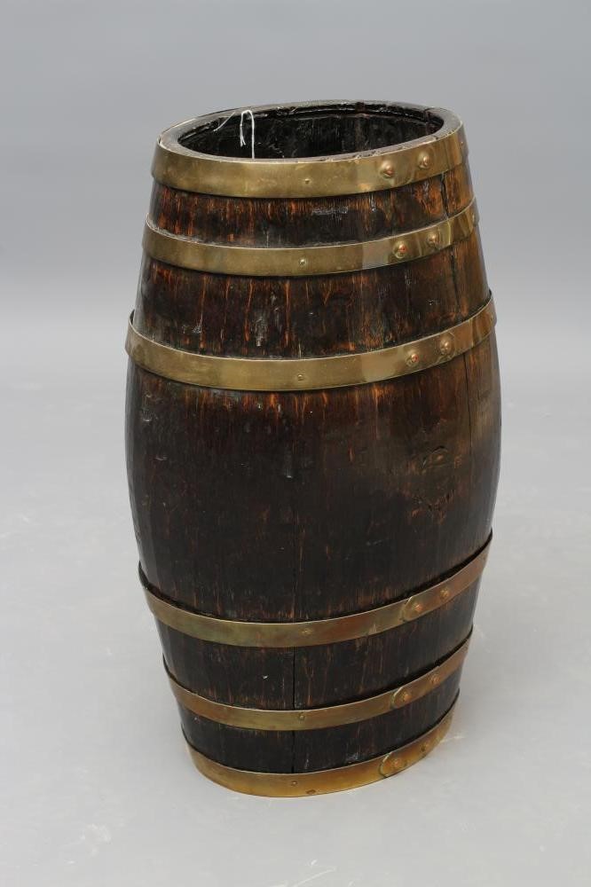 A COOPERED OAK STICK BARREL of oval form with brass banding Image