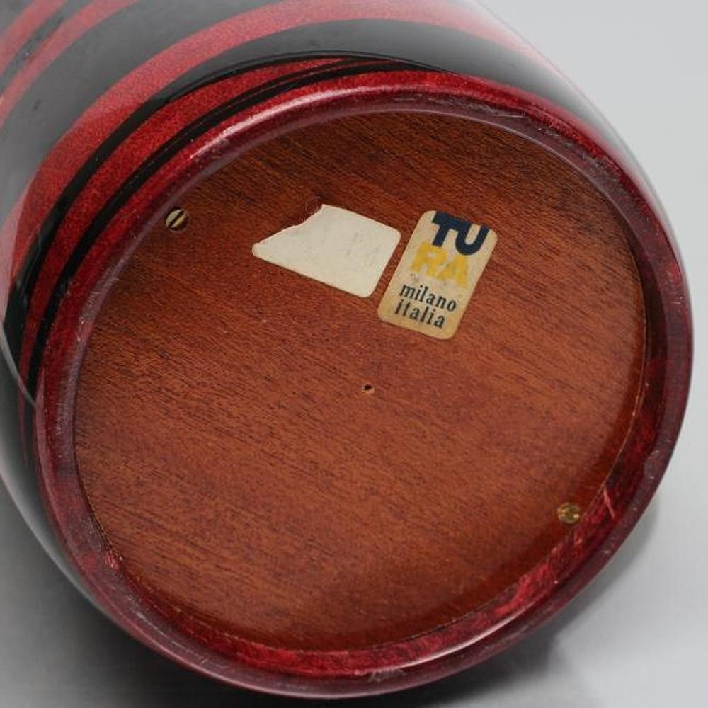 AN ITALIAN TURA COCKTAIL FLASK of plain cylindrical form with dark red and black lacquered stripes Image
