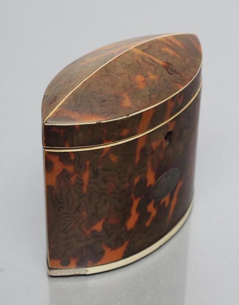 A REGENCY TORTOISESHELL SMALL TEA CADDY of navette form Image