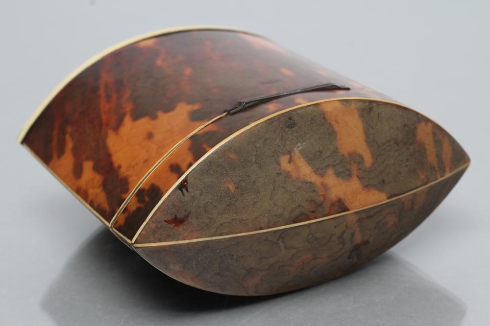A REGENCY TORTOISESHELL SMALL TEA CADDY of navette form Image