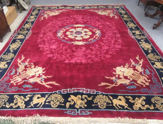 A CHINESE WASHED AND FRINGED CARPET Image