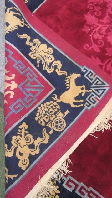 A CHINESE WASHED AND FRINGED CARPET Image