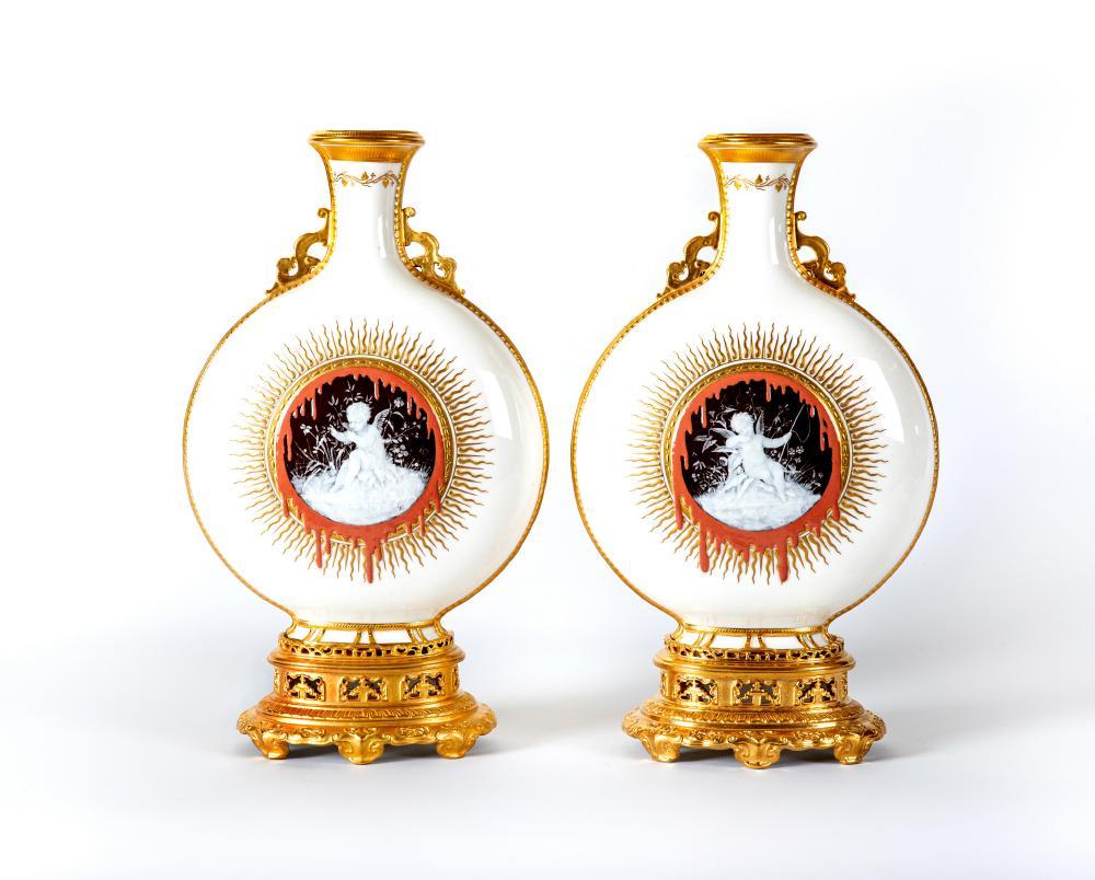 A PAIR OF DOCUMENTARY MINTON PORCELAIN PATE-SUR-PATE MOON FLASKS Image