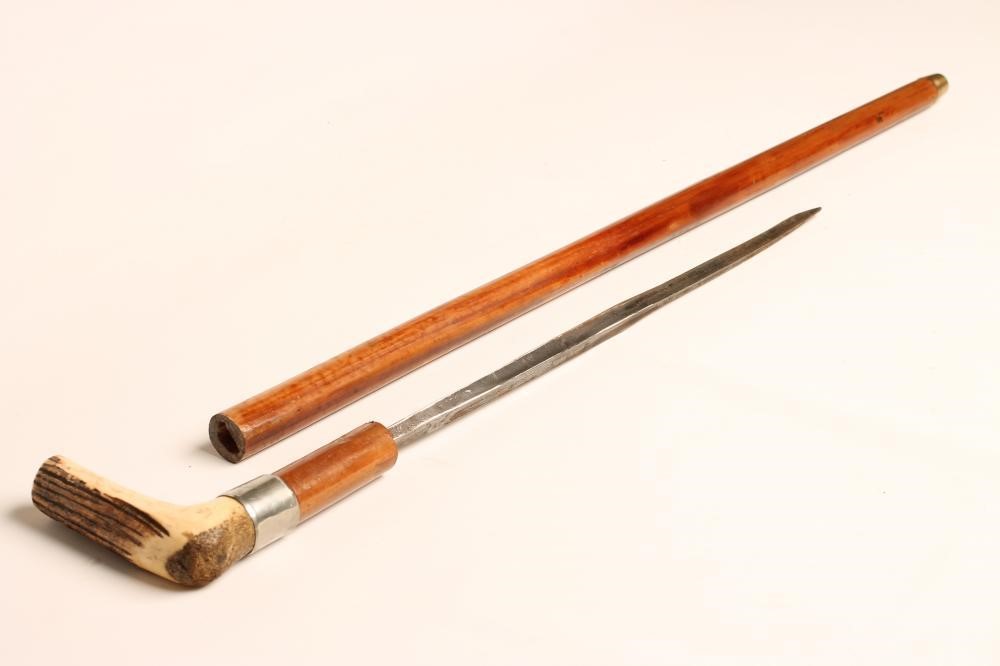 A MALACCA SWORD STICK with 17 3/4" triangular section blade bearing remnants of etched decoration Image