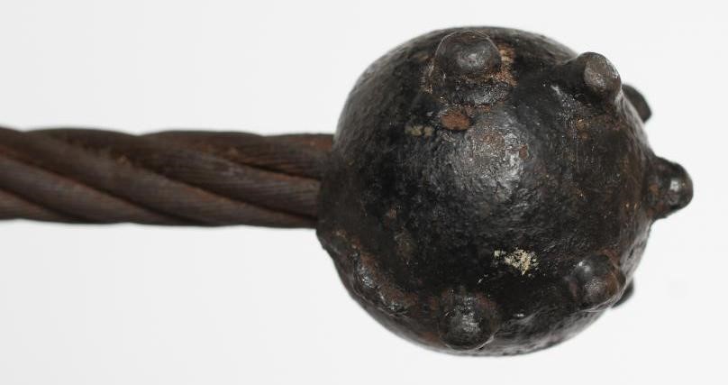 A FIRST WORLD WAR GERMAN TRENCH MACE with cast iron bulbous top and grip with flexible wire shaft Image