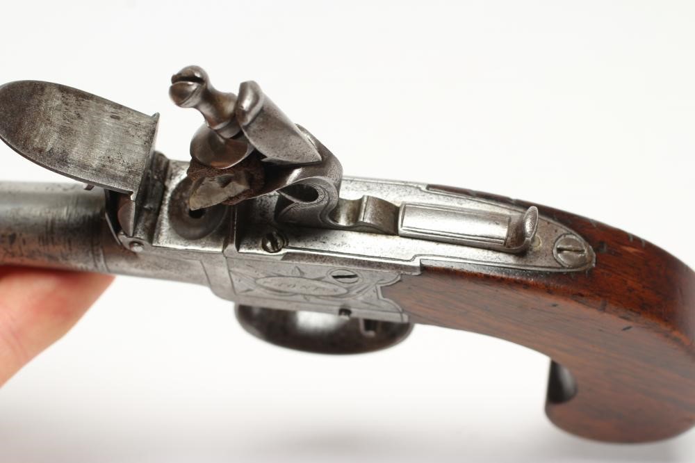 A FLINTLOCK POCKET PISTOL by Jones of London Image