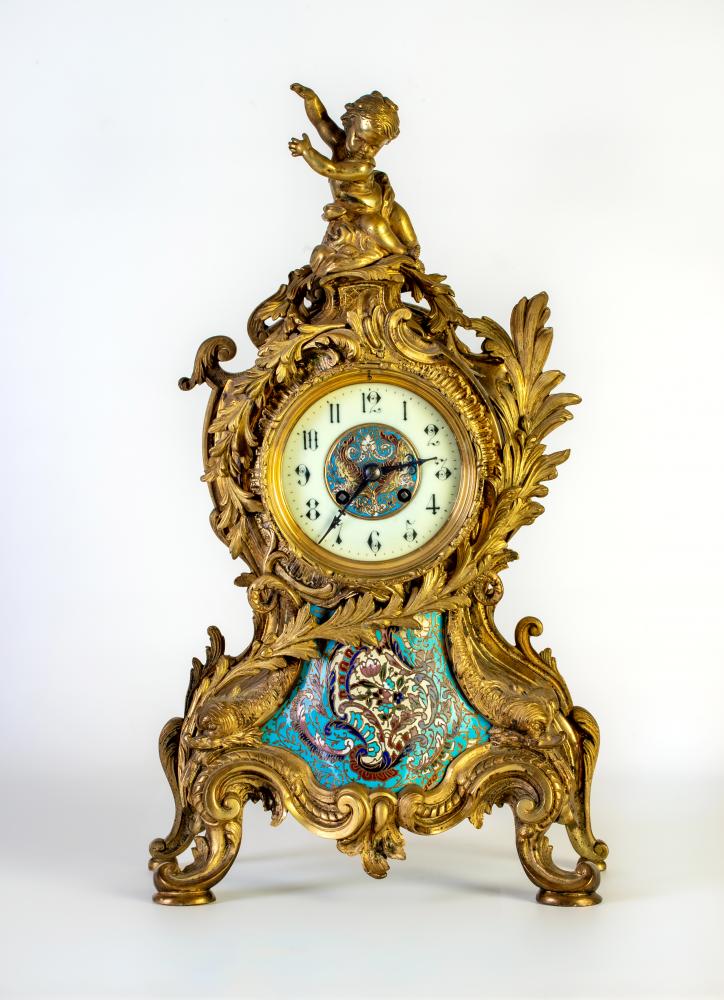 A FRENCH LOUIS XV STYLE ORMOLU AND CHAMPLEVE ENAMEL MANTEL CLOCK Image