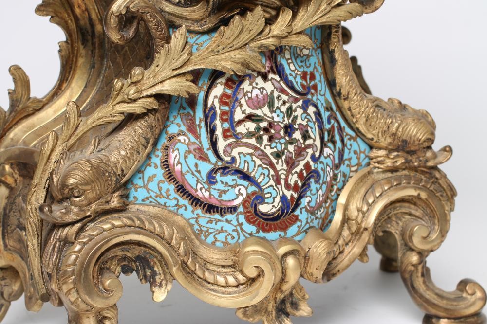 A FRENCH LOUIS XV STYLE ORMOLU AND CHAMPLEVE ENAMEL MANTEL CLOCK Image