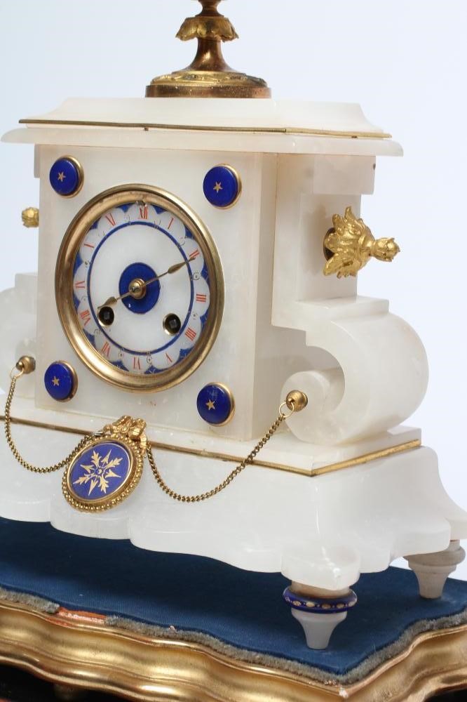 A FRENCH ALABASTER MANTEL CLOCK Image