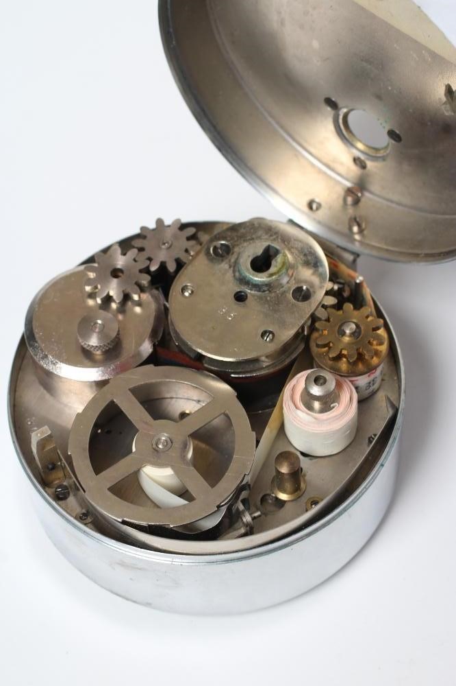 A FRENCH CHROME PLATED MILITARY RECORDING CLOCK with recording paper punch Image