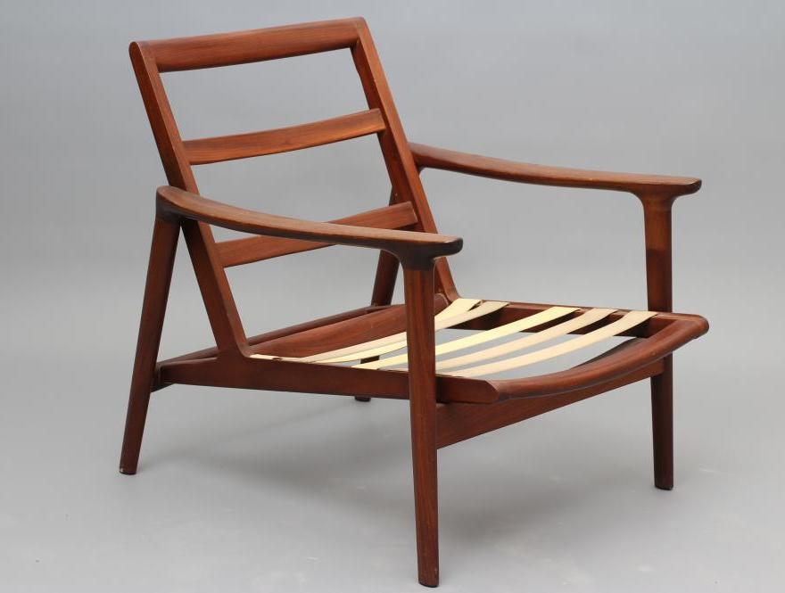 A RETRO TEAK FRAMED ARMCHAIR Image