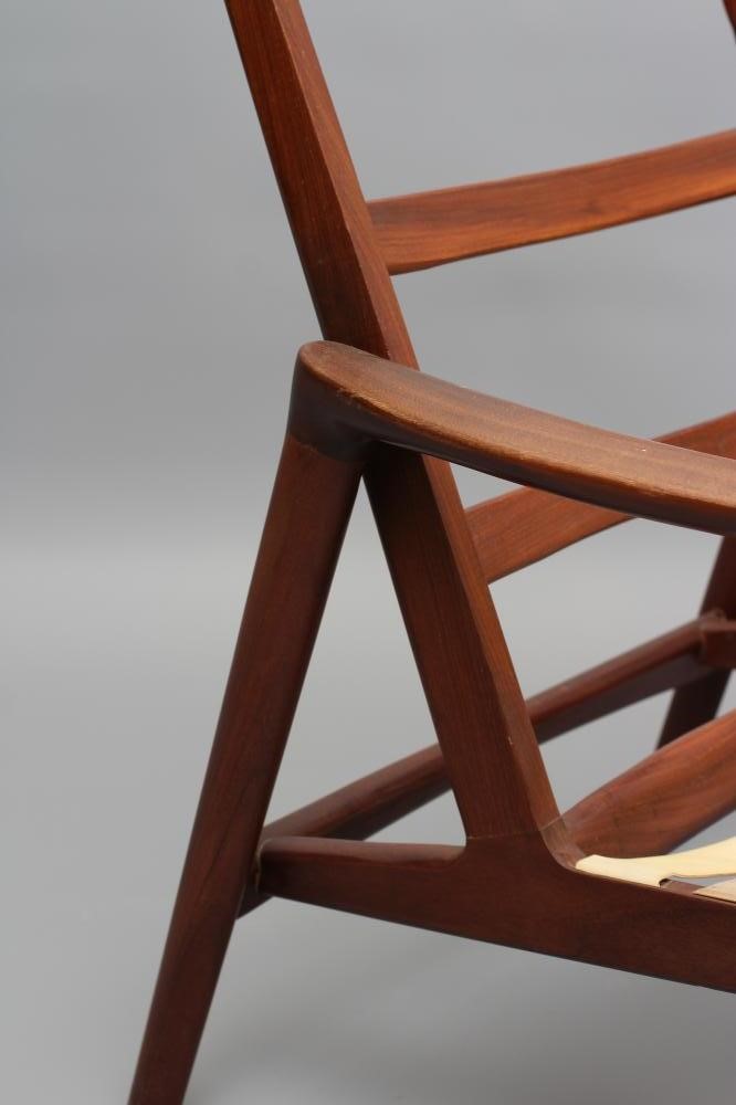 A RETRO TEAK FRAMED ARMCHAIR Image
