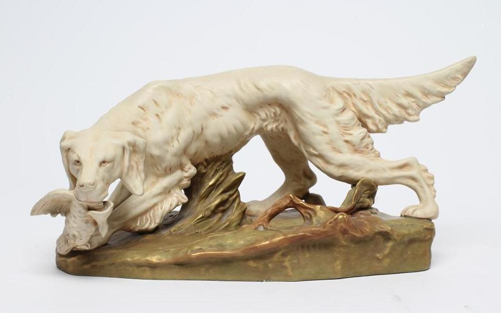 A ROYAL DUX BISQUE PORCELAIN SETTER Image