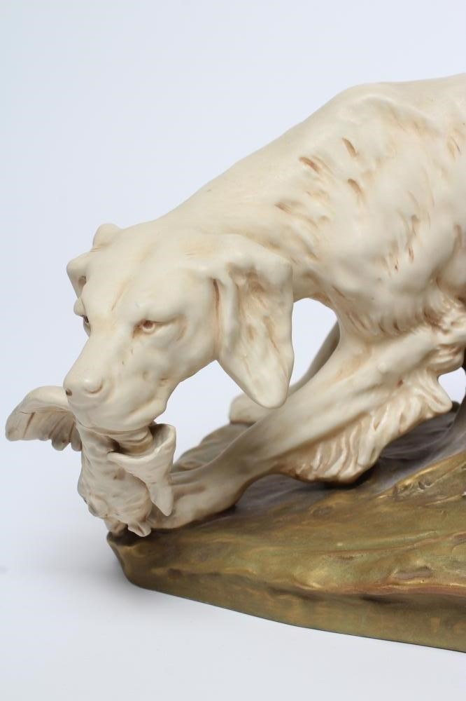 A ROYAL DUX BISQUE PORCELAIN SETTER Image