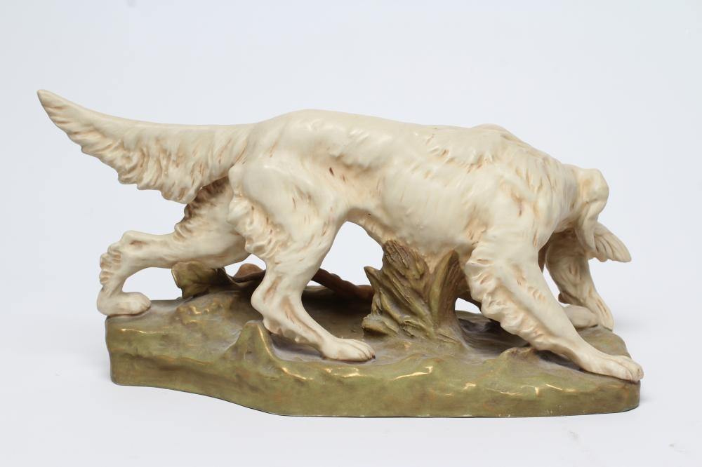 A ROYAL DUX BISQUE PORCELAIN SETTER Image