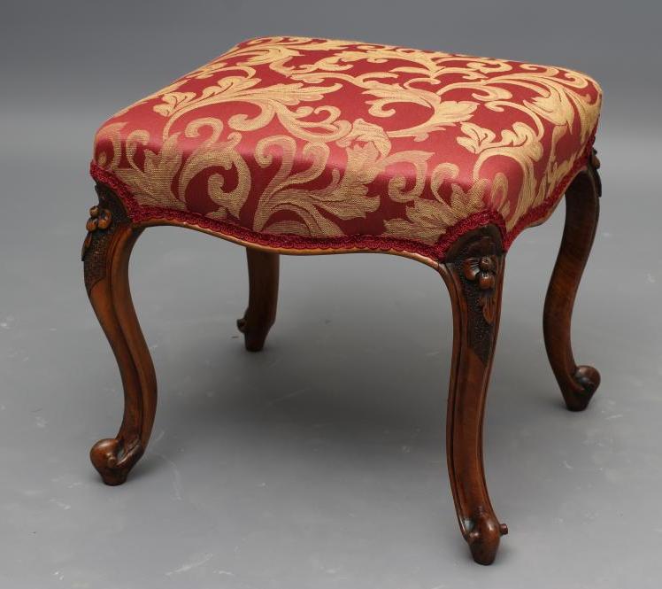 A VICTORIAN WALNUT DRESSING STOOL upholstered in a red and gold scrolling foliate weave Image