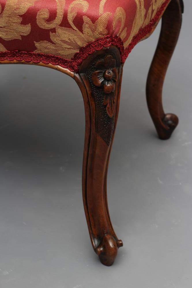 A VICTORIAN WALNUT DRESSING STOOL upholstered in a red and gold scrolling foliate weave Image