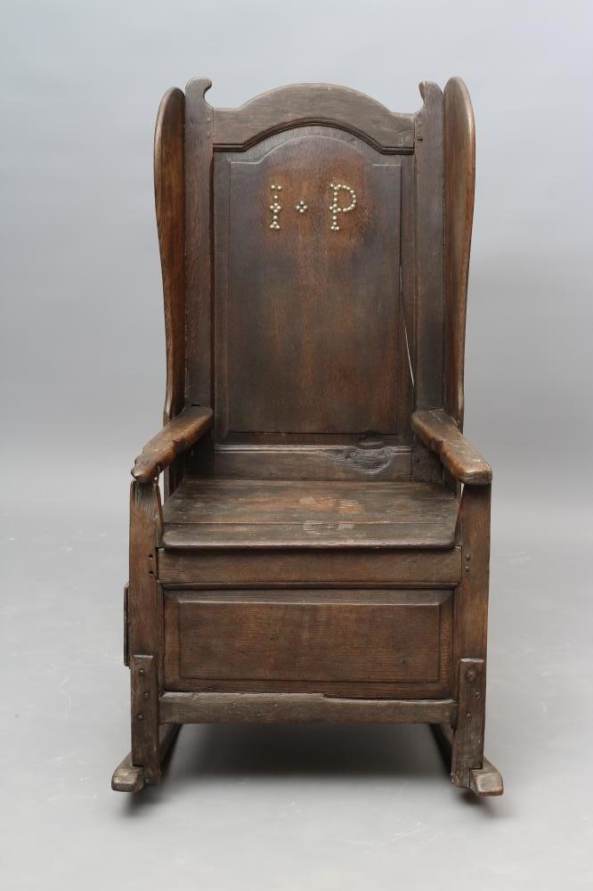 A JOINED OAK LAMBING WING ARMCHAIR Image