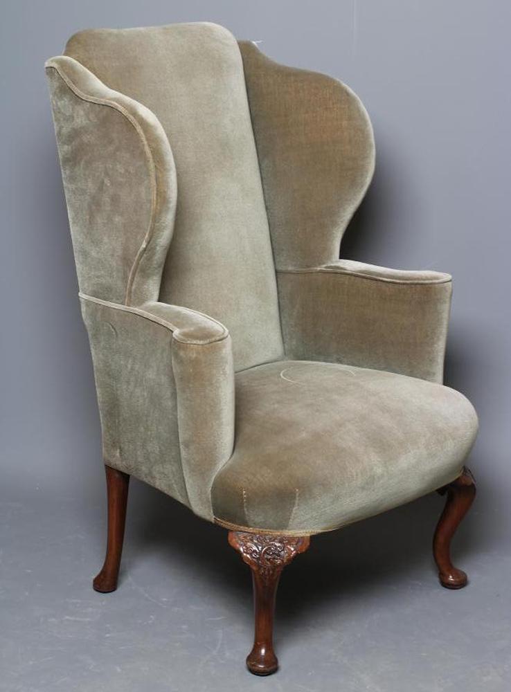 A BEECH FRAMED WING ARMCHAIR of early Georgian design upholstered in pale green dralon Image