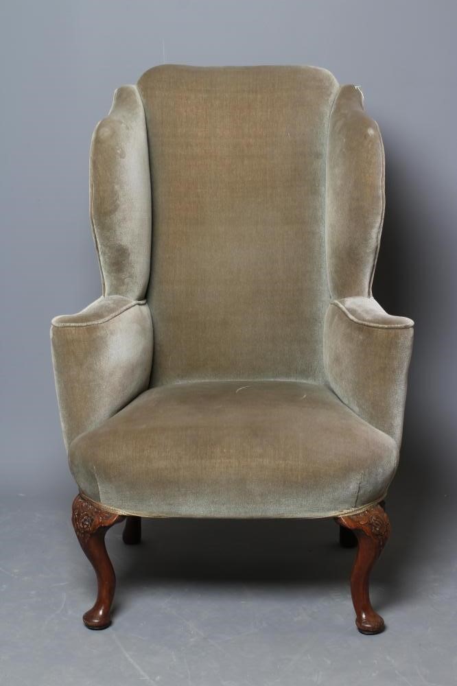 A BEECH FRAMED WING ARMCHAIR of early Georgian design upholstered in pale green dralon Image