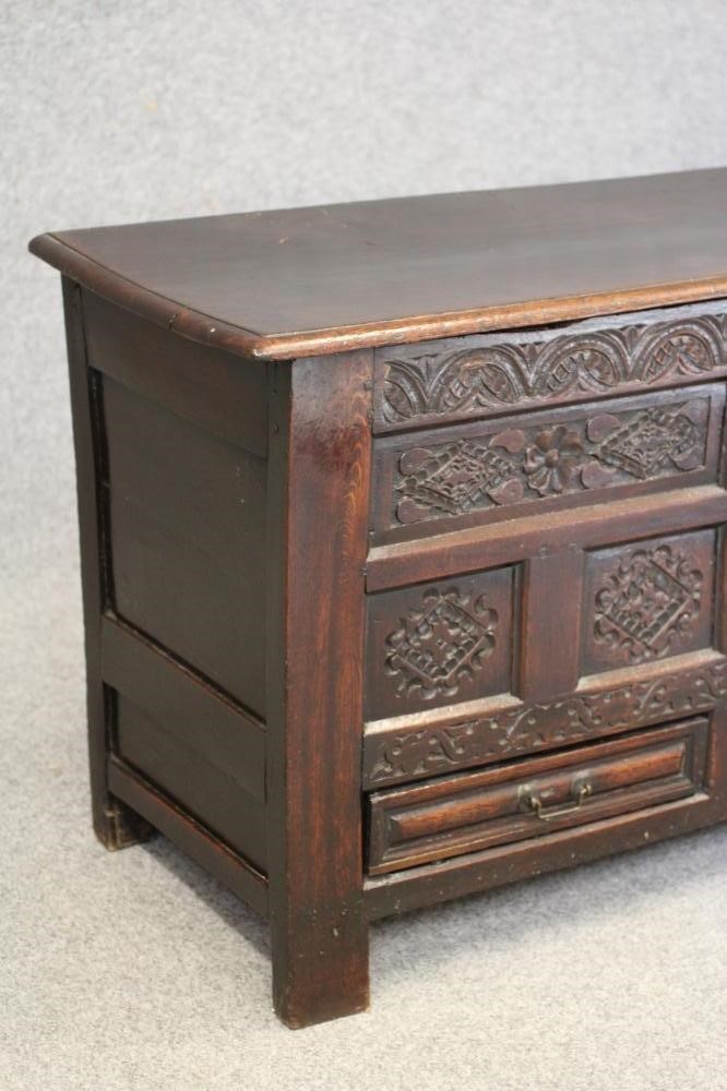 AN OAK PANELLED CHEST Image