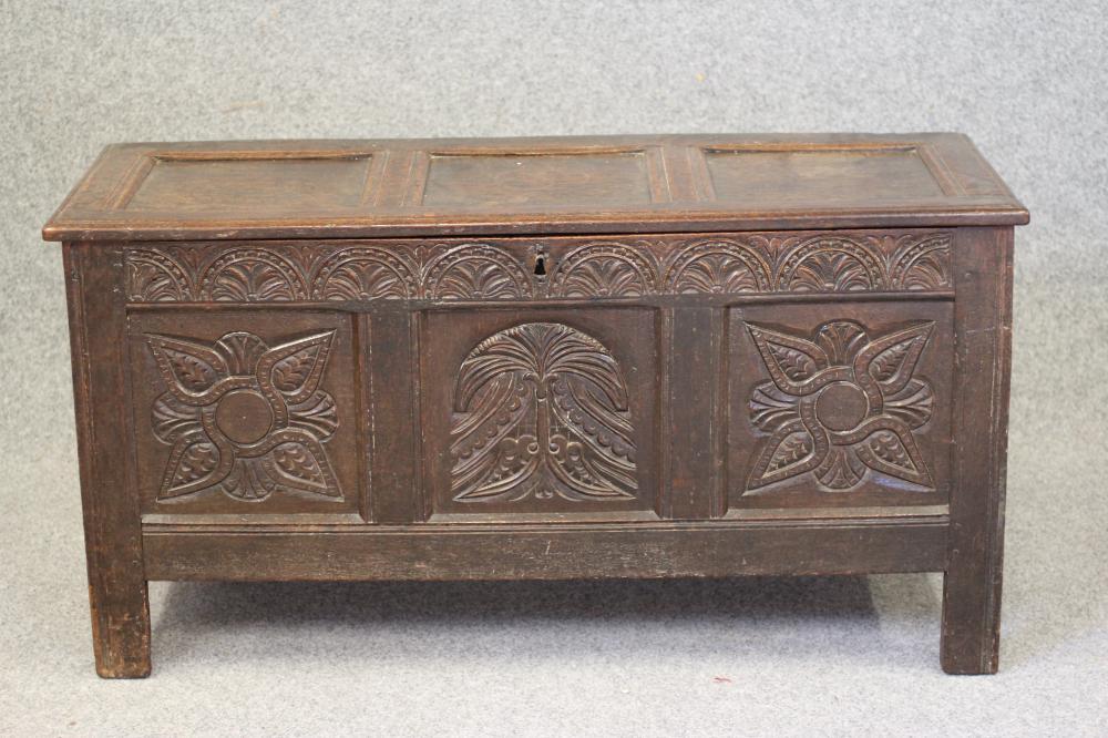 AN OAK PANELLED COFFER Image