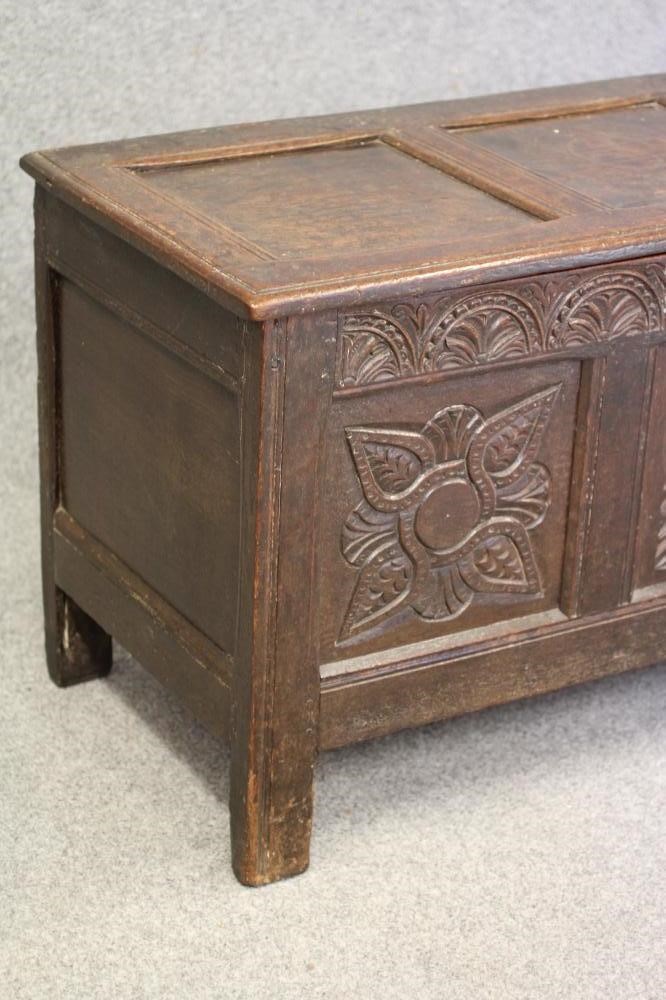 AN OAK PANELLED COFFER Image