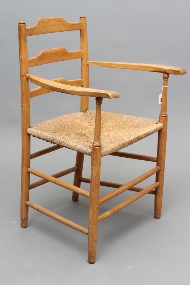 AN ARTS AND CRAFTS ELBOW CHAIR Image