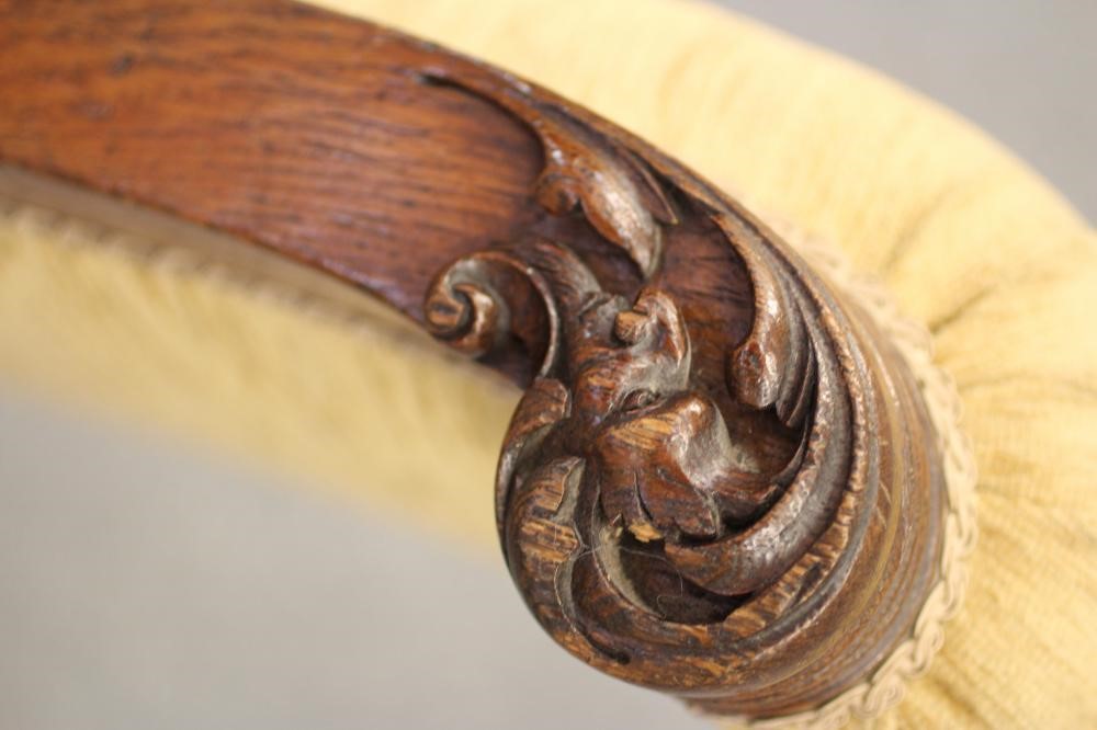 A GENTLEMAN'S VICTORIAN OAK FRAMED ARMCHAIR upholstered in gold chenille Image