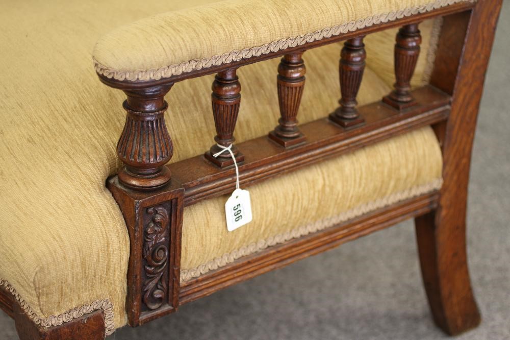A GENTLEMAN'S VICTORIAN OAK FRAMED ARMCHAIR upholstered in gold chenille Image