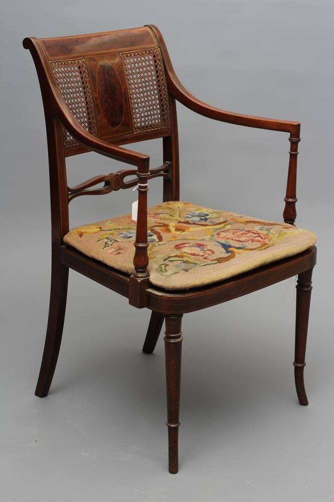 AN EDWARDIAN MAHOGANY CANED ELBOW CHAIR Image