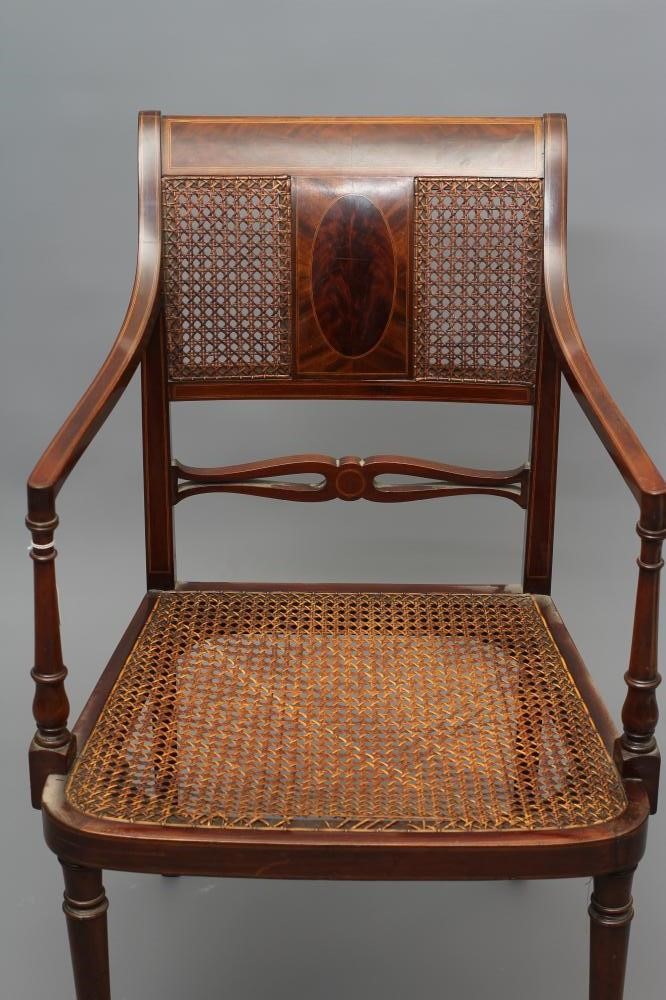 AN EDWARDIAN MAHOGANY CANED ELBOW CHAIR Image