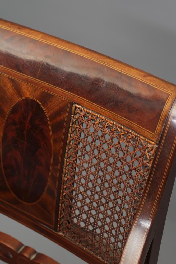 AN EDWARDIAN MAHOGANY CANED ELBOW CHAIR Image