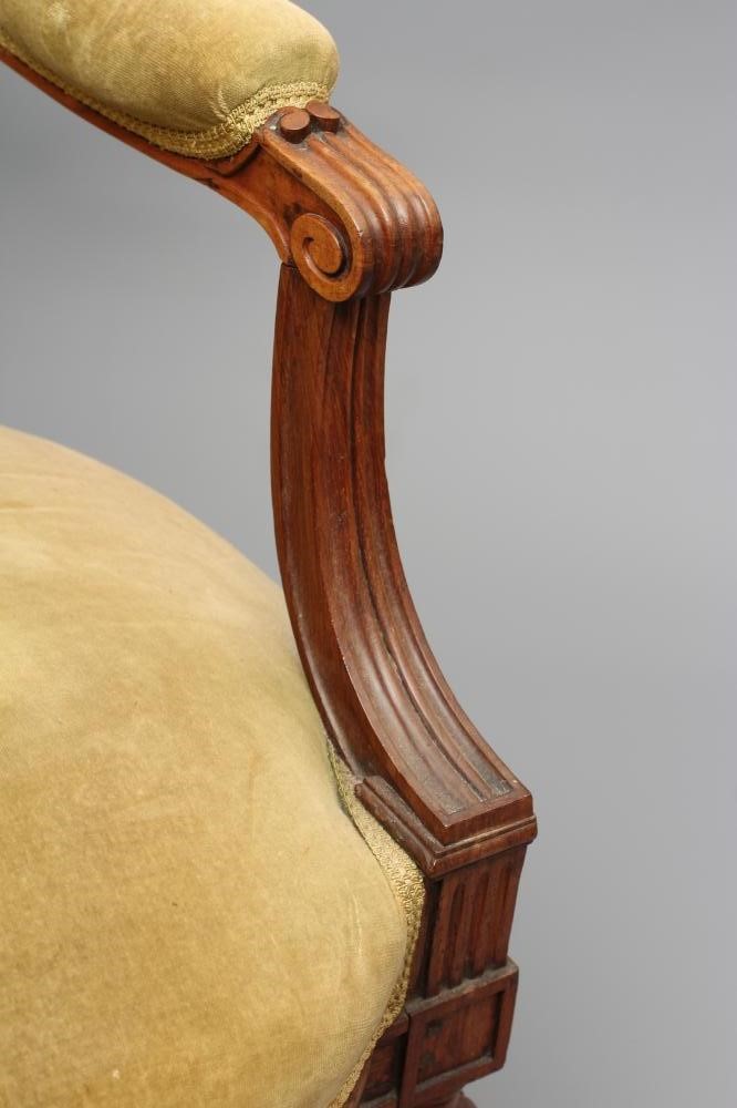 A VICTORIAN ROSEWOOD ARMCHAIR in the Louis XVI style Image
