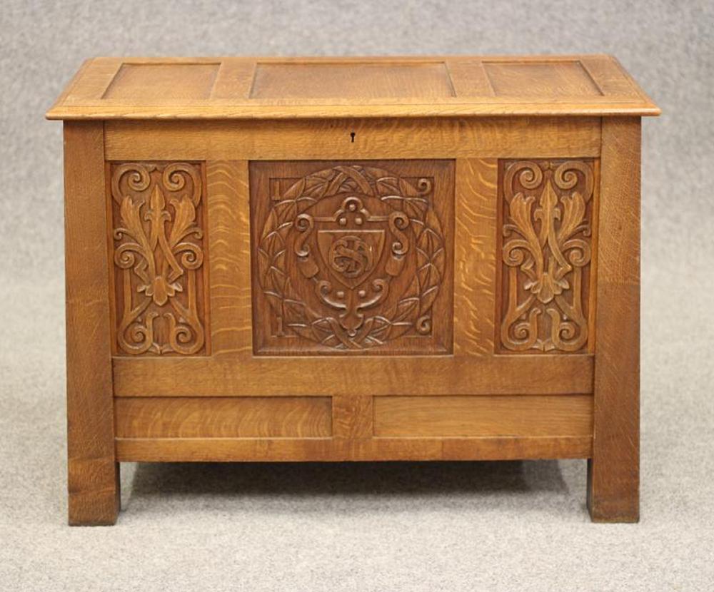 AN ARTS AND CRAFTS STYLE OAK PANELLED CHEST Image