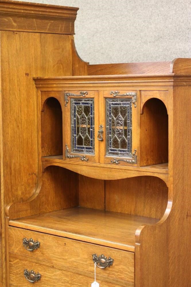 A GENTLEMAN'S ARTS AND CRAFTS STYLE OAK WARDROBE Image