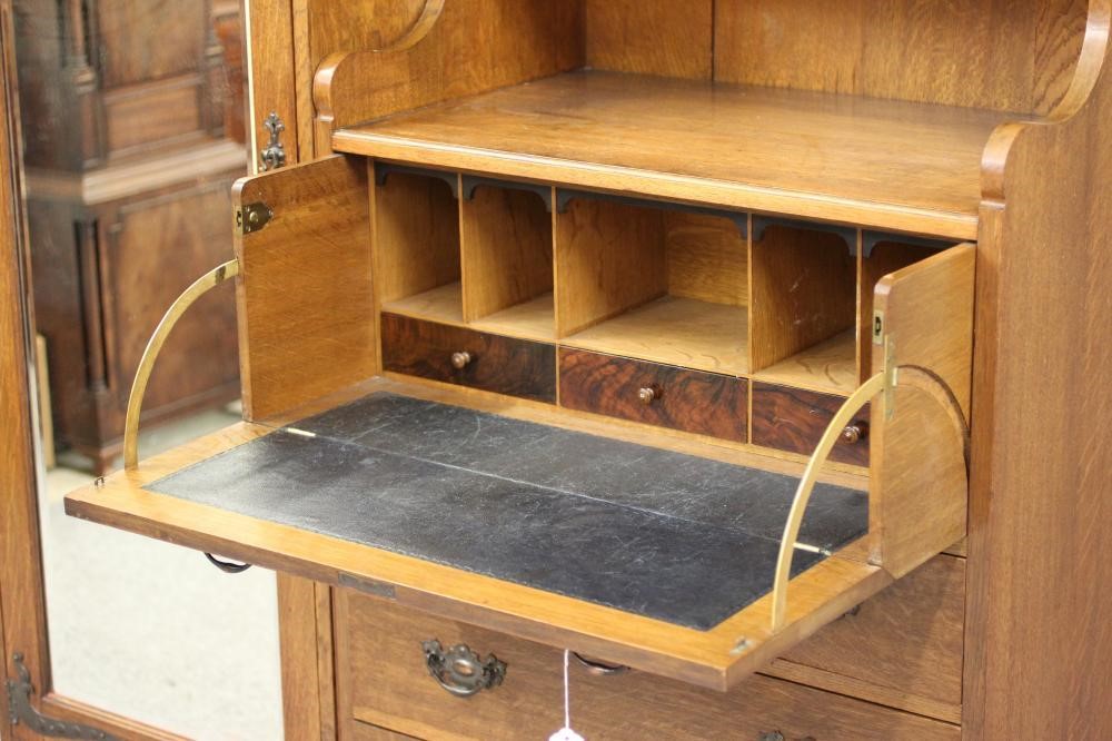 A GENTLEMAN'S ARTS AND CRAFTS STYLE OAK WARDROBE Image