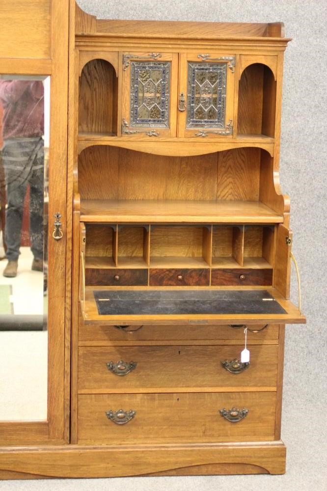 A GENTLEMAN'S ARTS AND CRAFTS STYLE OAK WARDROBE Image