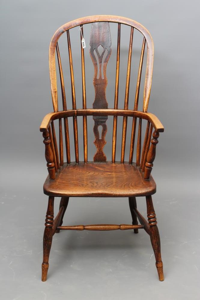 A  WINDSOR SPINDLE BACK ARMCHAIR in ash and elm Image