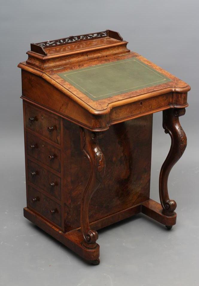 A VICTORIAN WALNUT DAVENPORT Image