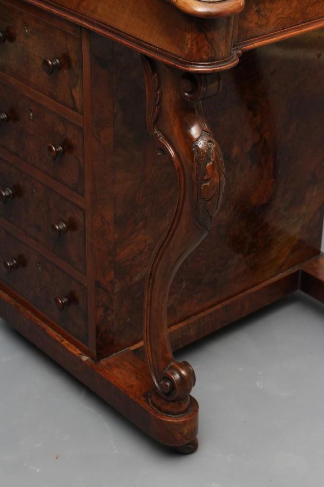 A VICTORIAN WALNUT DAVENPORT Image