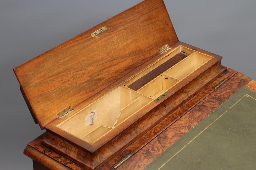 A VICTORIAN WALNUT DAVENPORT Image