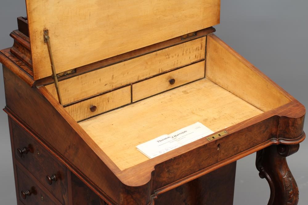 A VICTORIAN WALNUT DAVENPORT Image